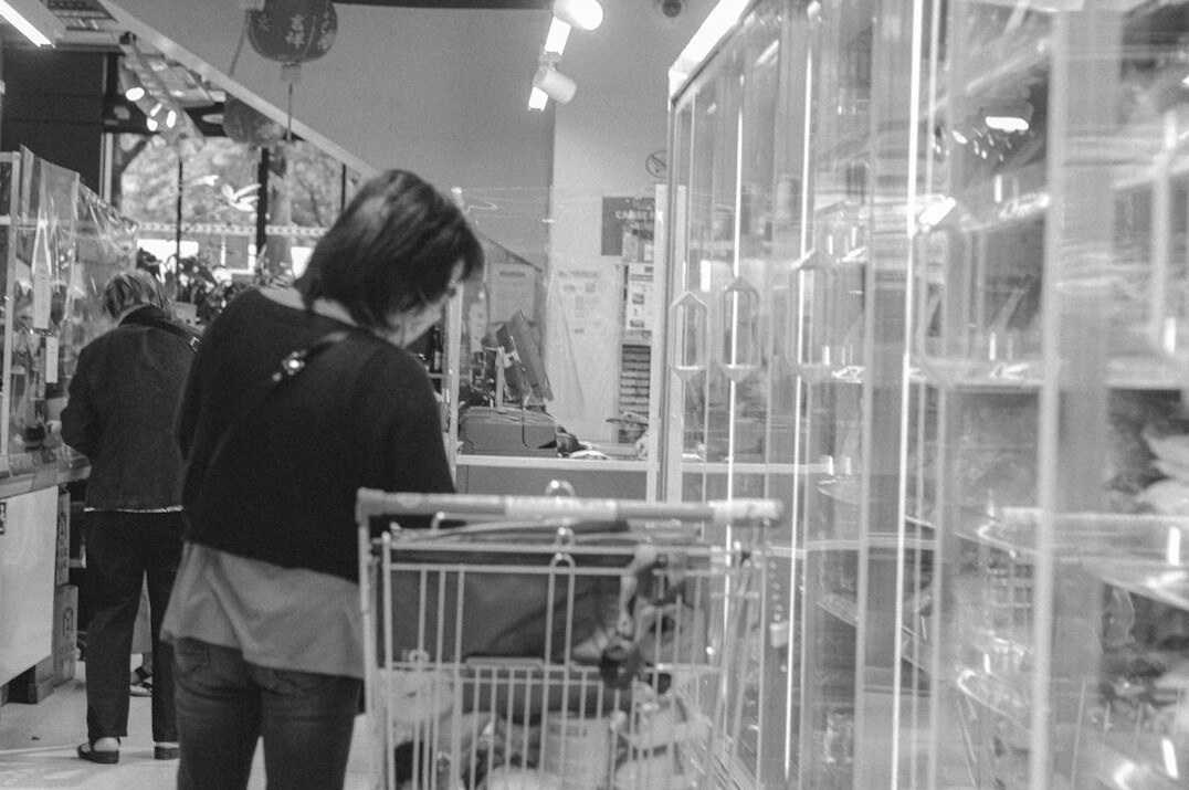 store detective observing shoppers