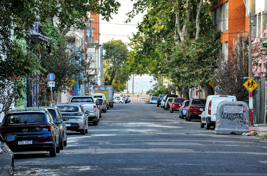 Old cobblestone street in Ciudad Vieja Montevideo at dusk with vintage streetlamps
